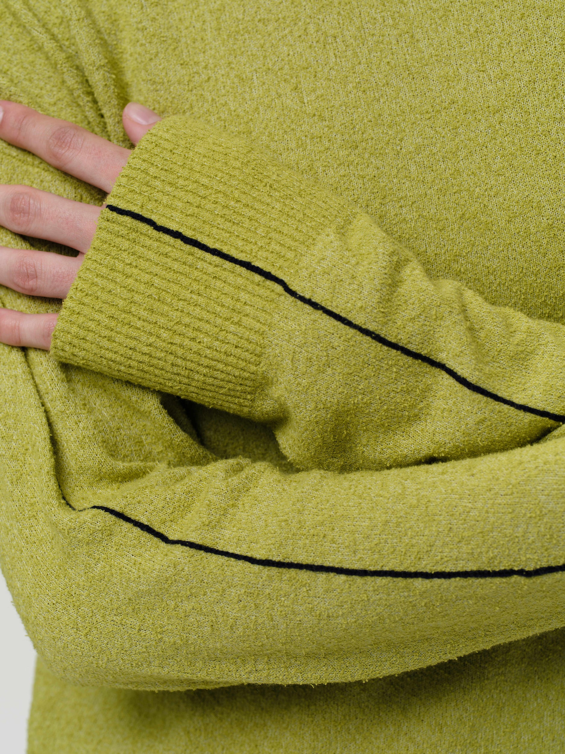 Lightweight bouclé knit summer sweater with a relaxed fit, featuring contrast stripe detailing at the back and sleeves and wide ribbed cuffs.