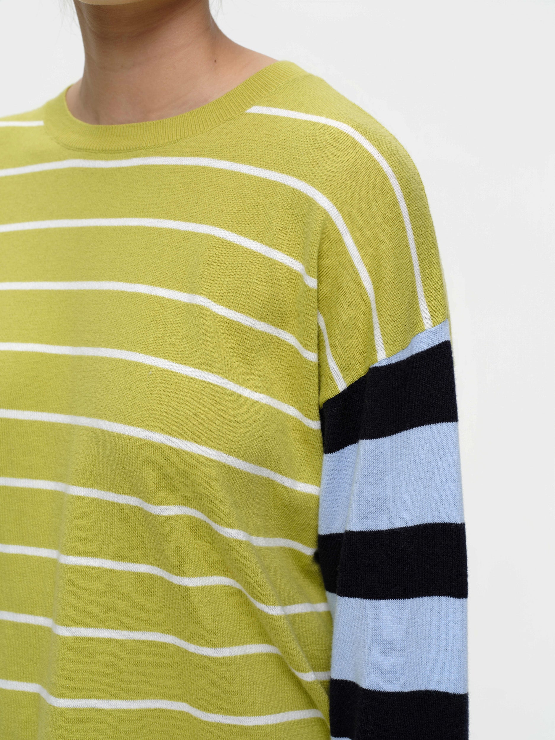 Striped knit sweater in a soft cotton cashmere blend, featuring bold seasonal colours, contrasting sleeve details, and a clean straight fit.