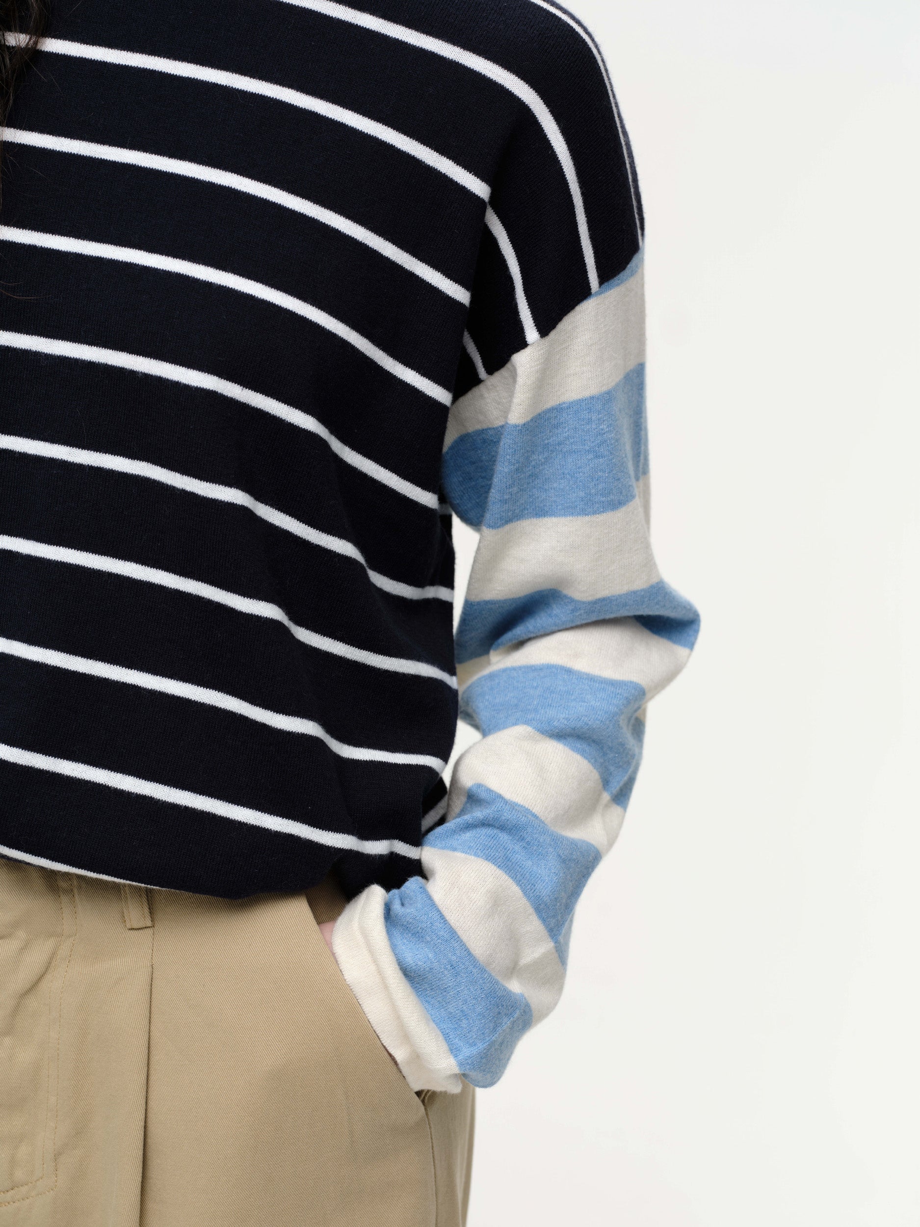 Striped knit sweater in a soft cotton cashmere blend, featuring bold seasonal colours, contrasting sleeve details, and a clean straight fit.