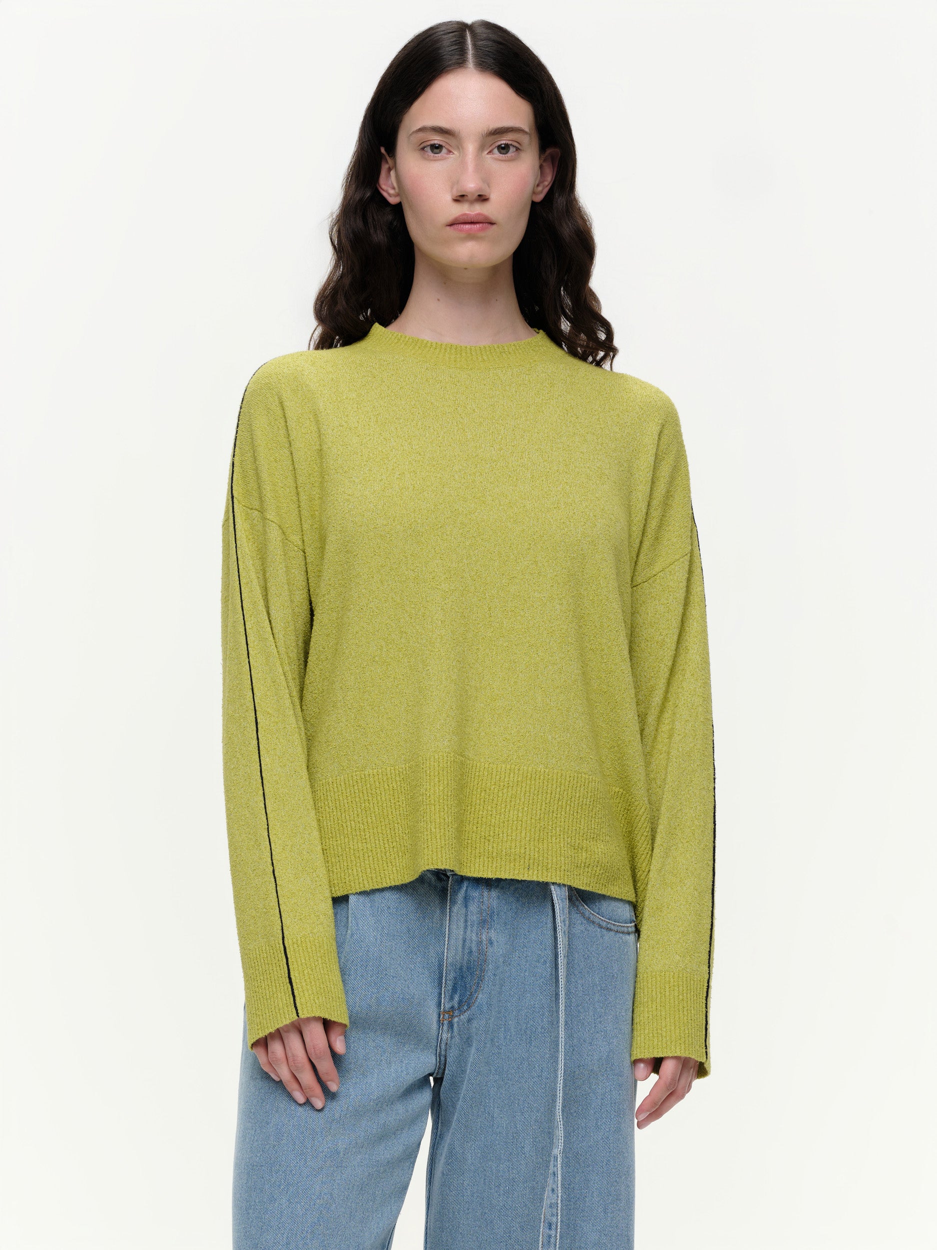 Lightweight bouclé knit summer sweater with a relaxed fit, featuring contrast stripe detailing at the back and sleeves and wide ribbed cuffs.