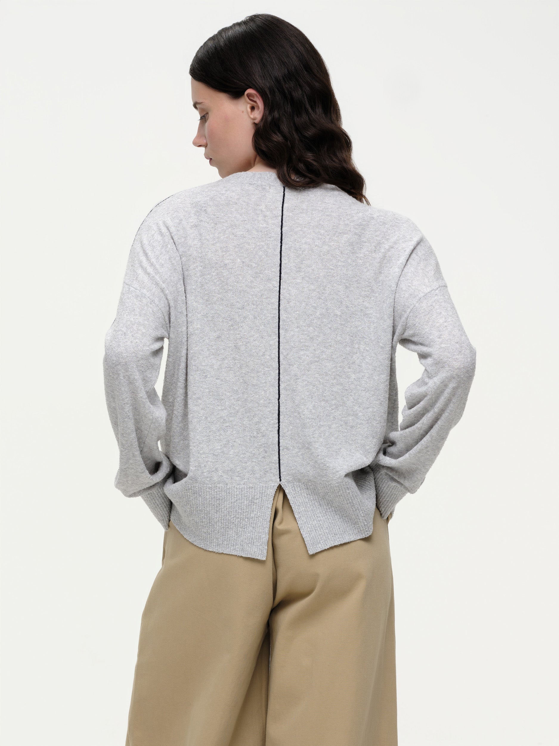 Lightweight bouclé knit summer sweater with a relaxed fit, featuring contrast stripe detailing at the back and sleeves and wide ribbed cuffs.