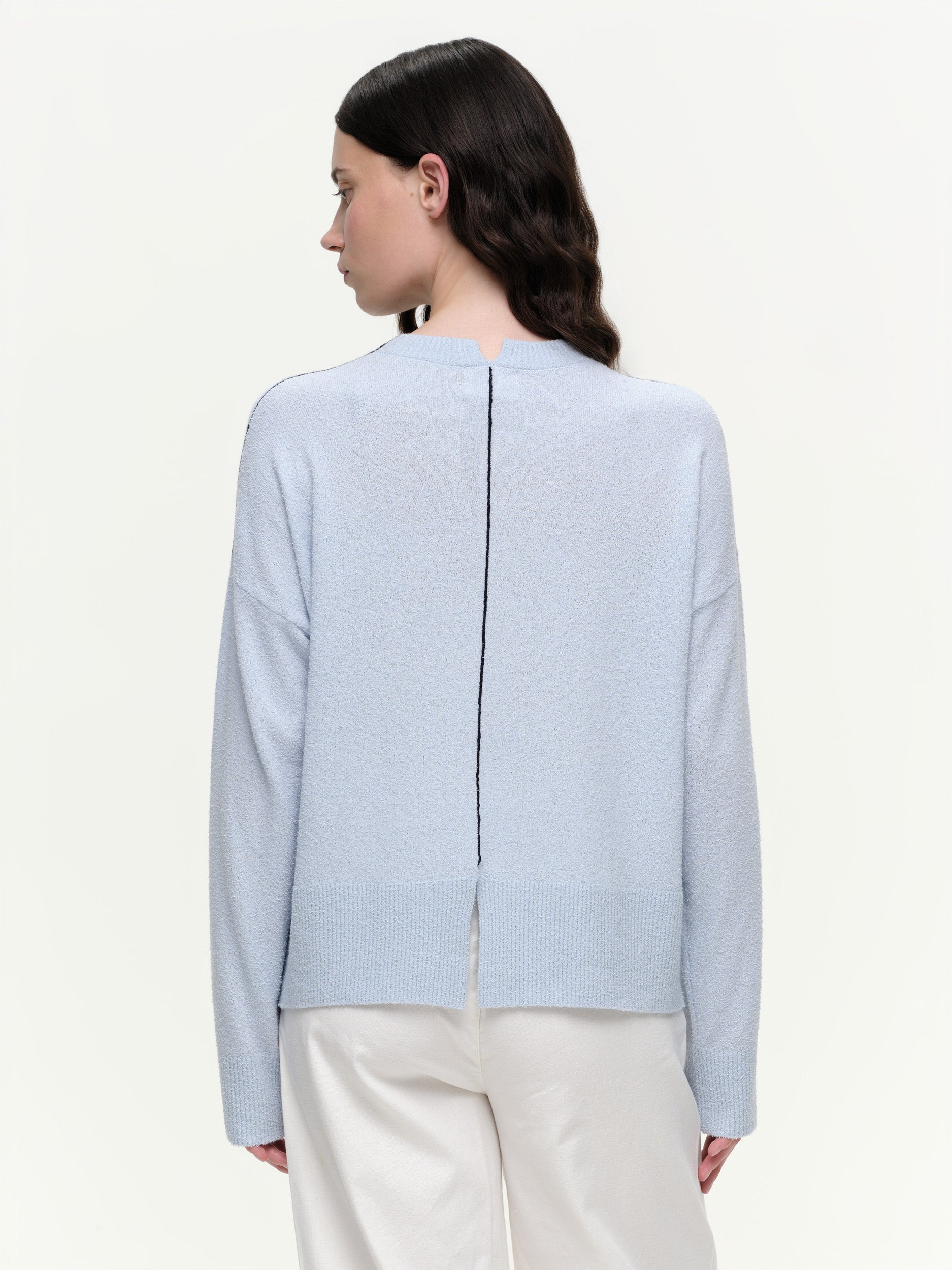 Lightweight bouclé knit summer sweater with a relaxed fit, featuring contrast stripe detailing at the back and sleeves and wide ribbed cuffs.