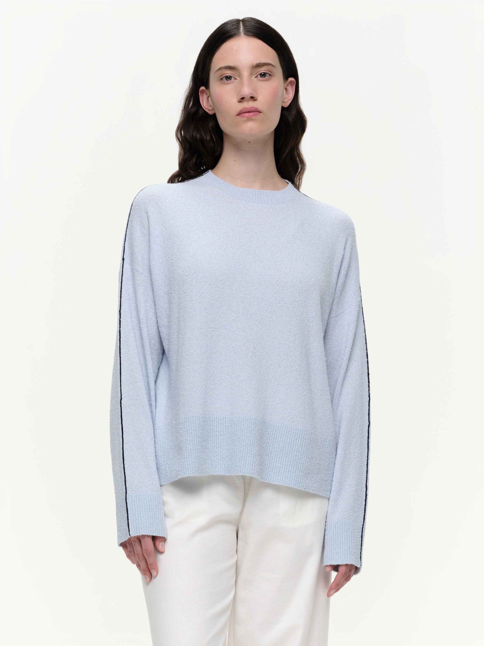 Lightweight bouclé knit summer sweater with a relaxed fit, featuring contrast stripe detailing at the back and sleeves and wide ribbed cuffs.