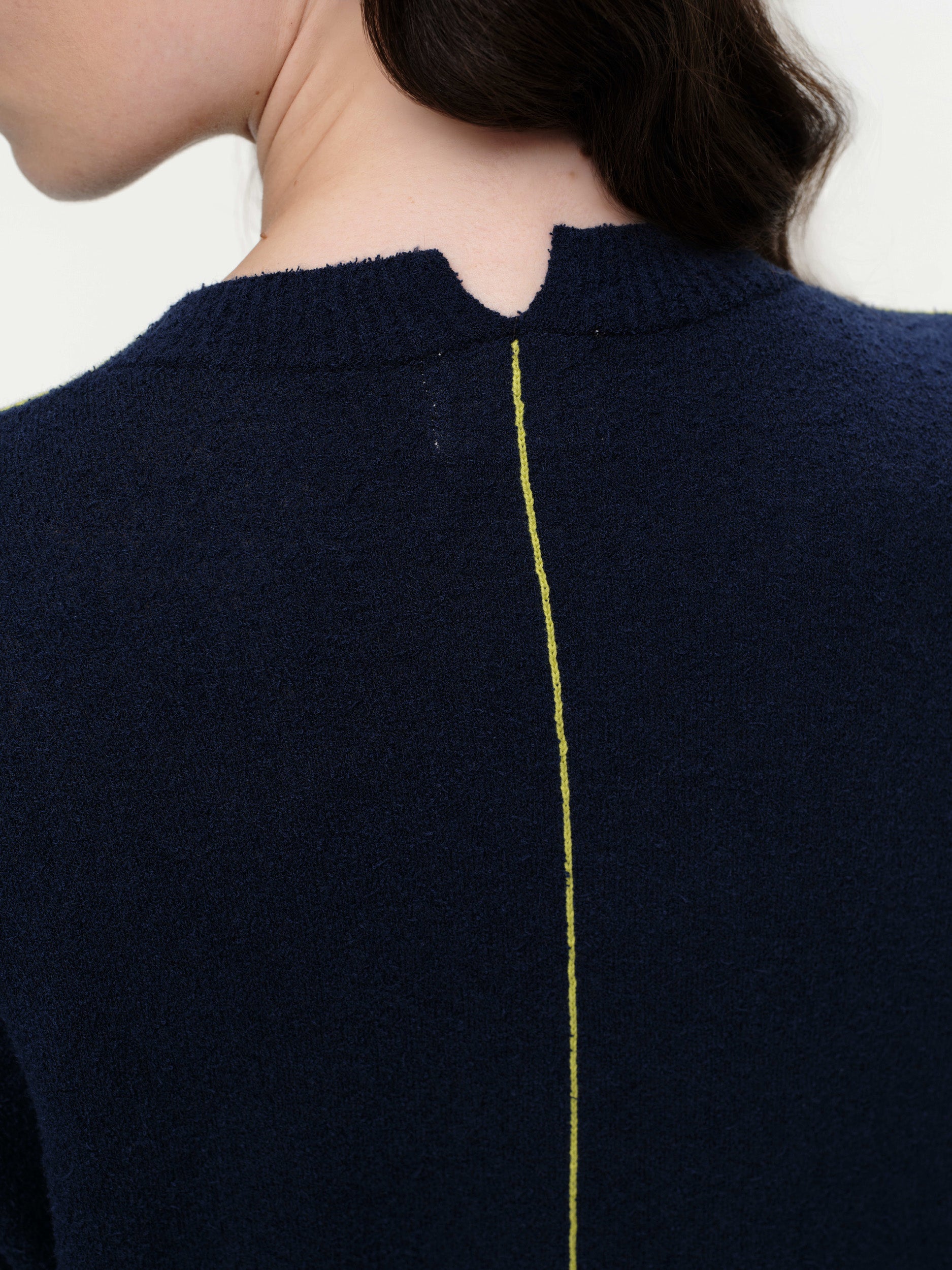 Lightweight bouclé knit summer sweater with a relaxed fit, featuring contrast stripe detailing at the back and sleeves and wide ribbed cuffs.