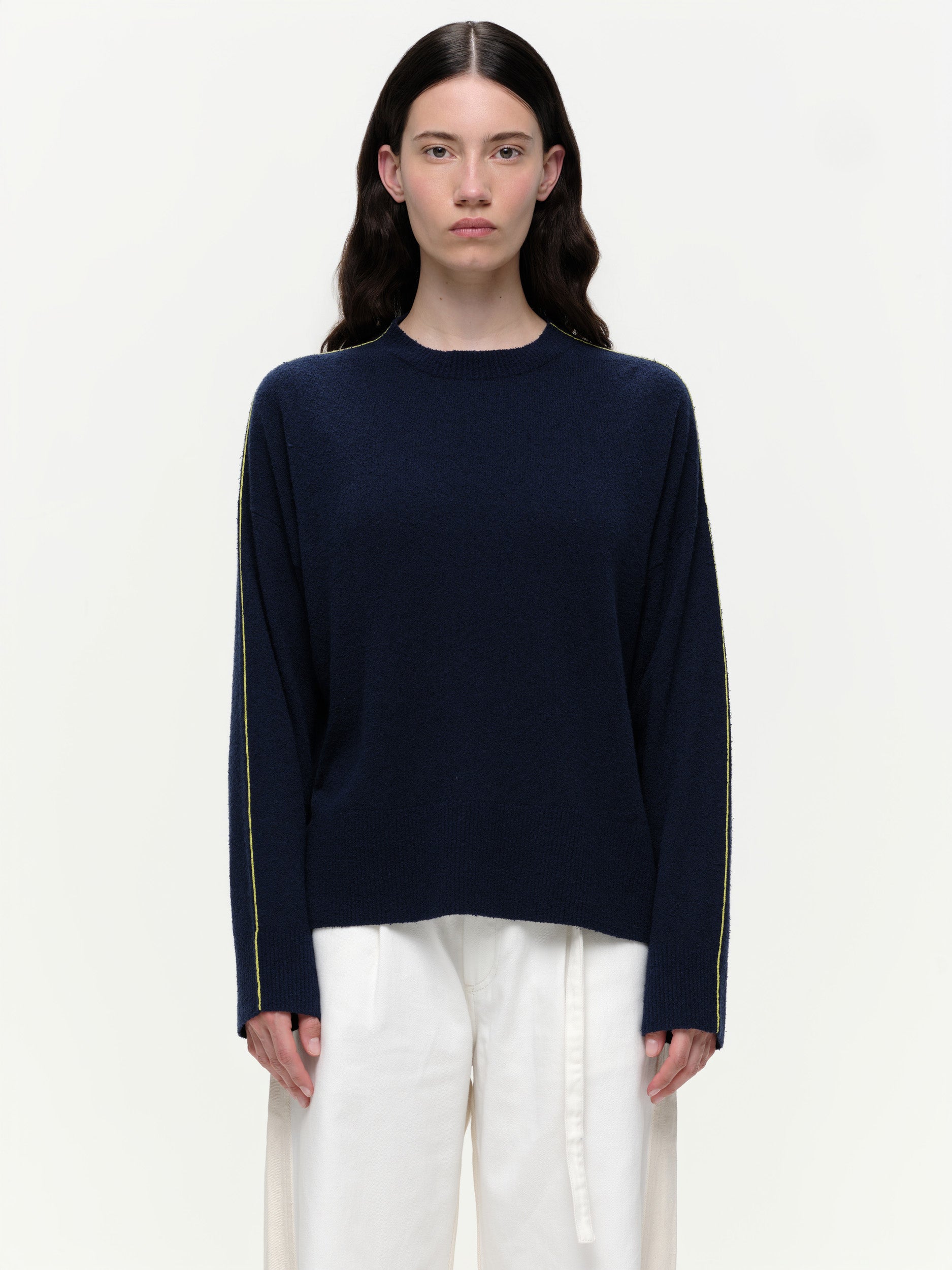 Lightweight bouclé knit summer sweater with a relaxed fit, featuring contrast stripe detailing at the back and sleeves and wide ribbed cuffs.