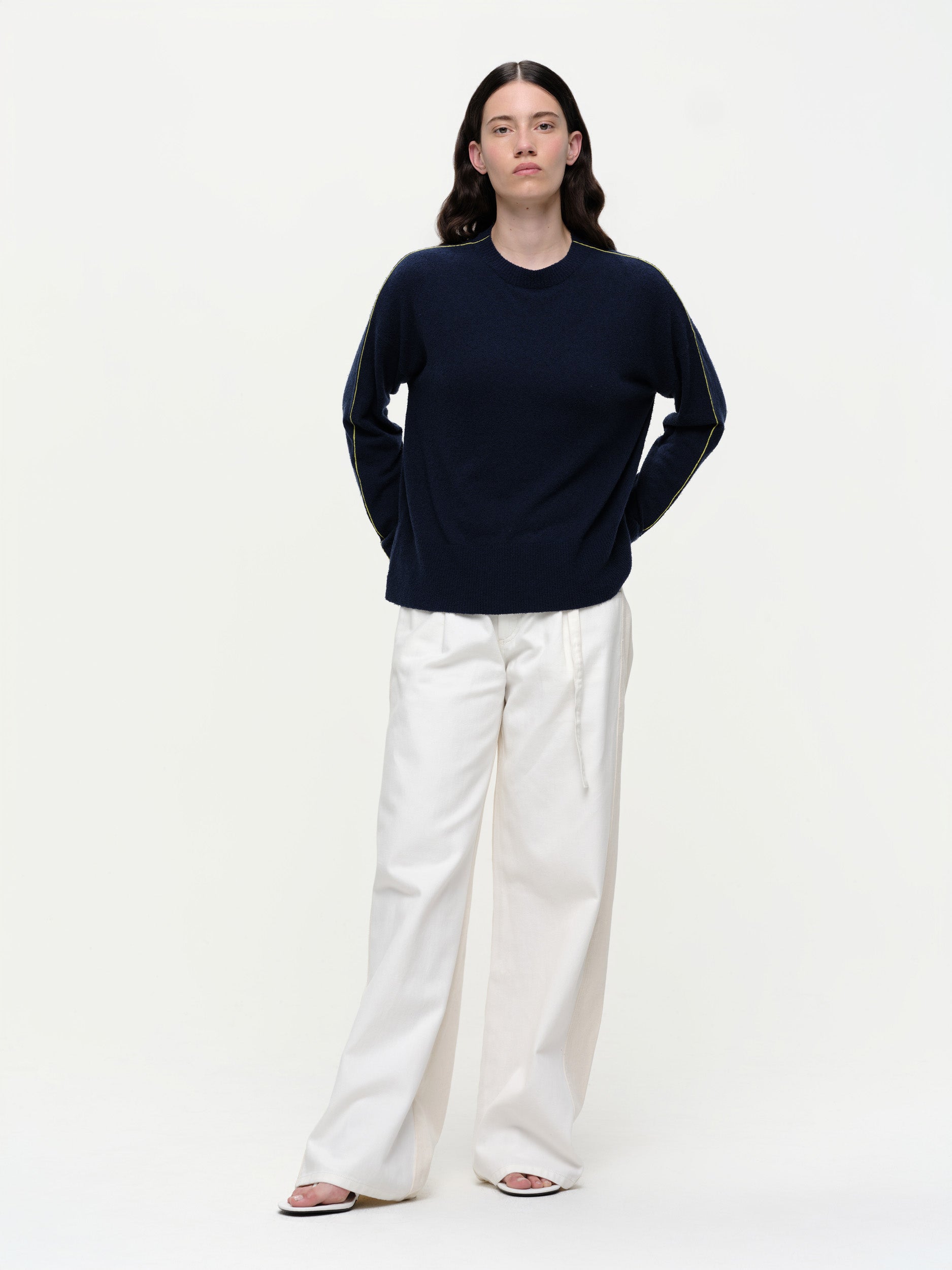 Lightweight bouclé knit summer sweater with a relaxed fit, featuring contrast stripe detailing at the back and sleeves and wide ribbed cuffs.