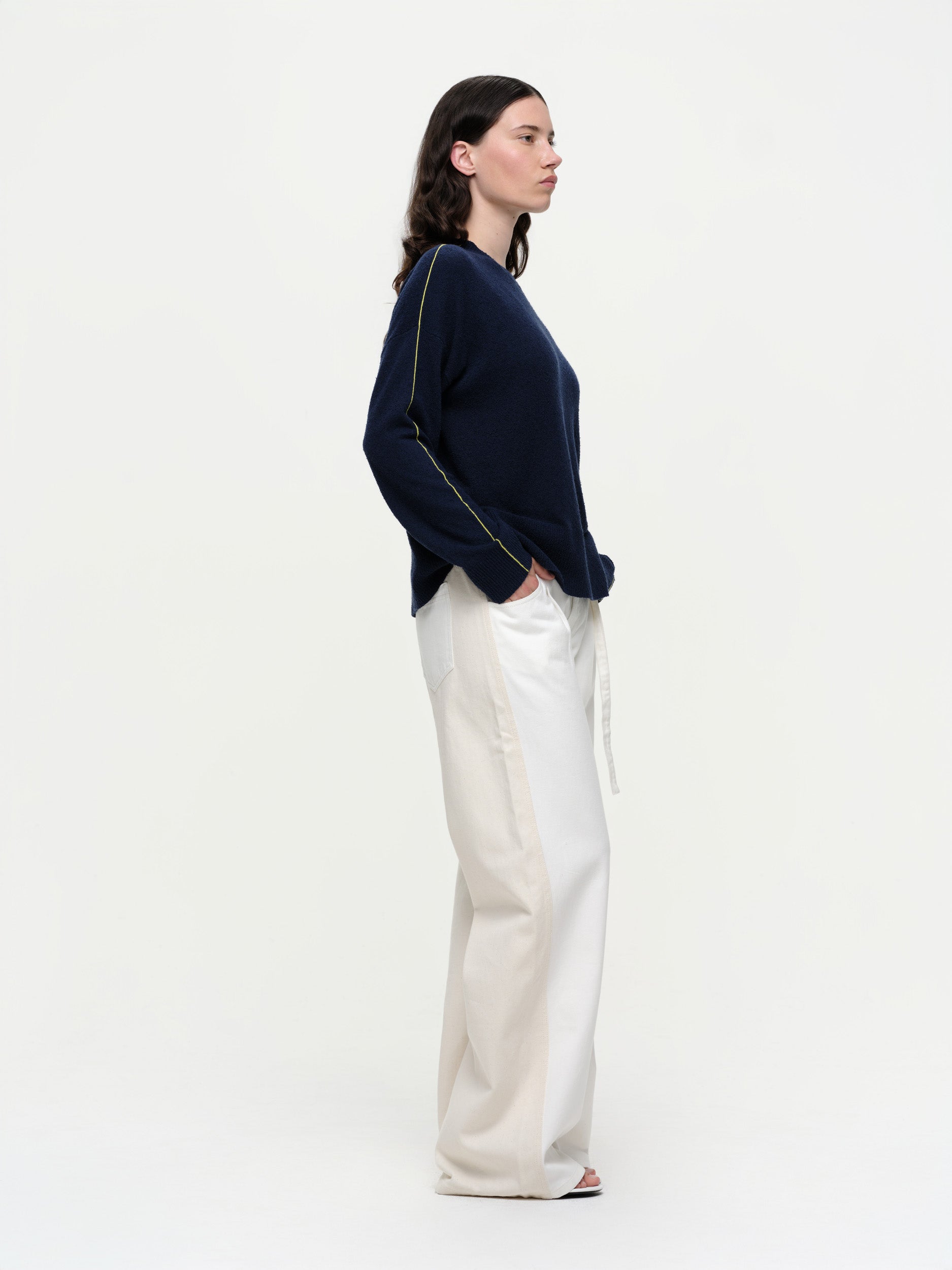 Lightweight bouclé knit summer sweater with a relaxed fit, featuring contrast stripe detailing at the back and sleeves and wide ribbed cuffs.