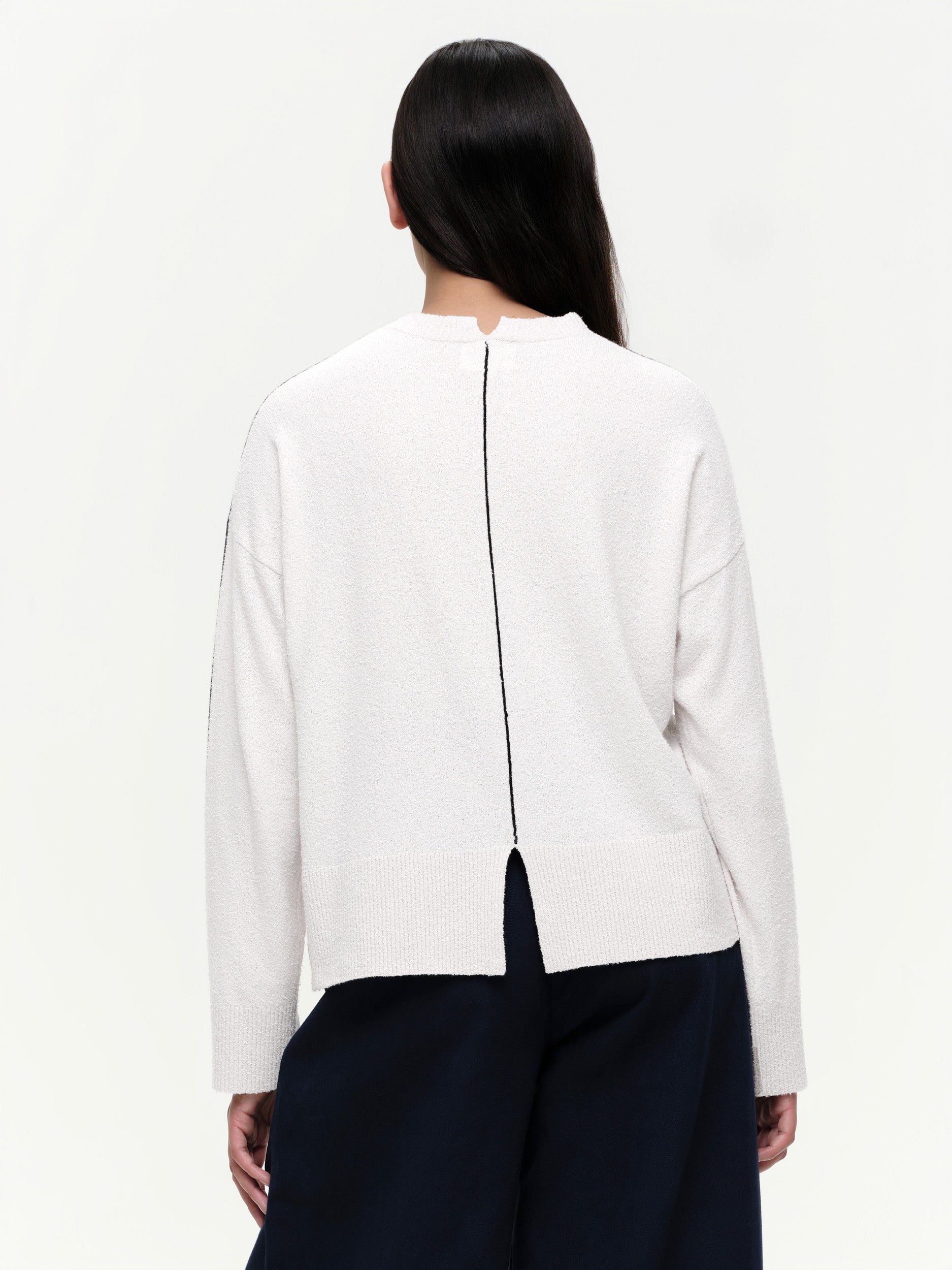 Lightweight bouclé knit summer sweater with a relaxed fit, featuring contrast stripe detailing at the back and sleeves and wide ribbed cuffs.