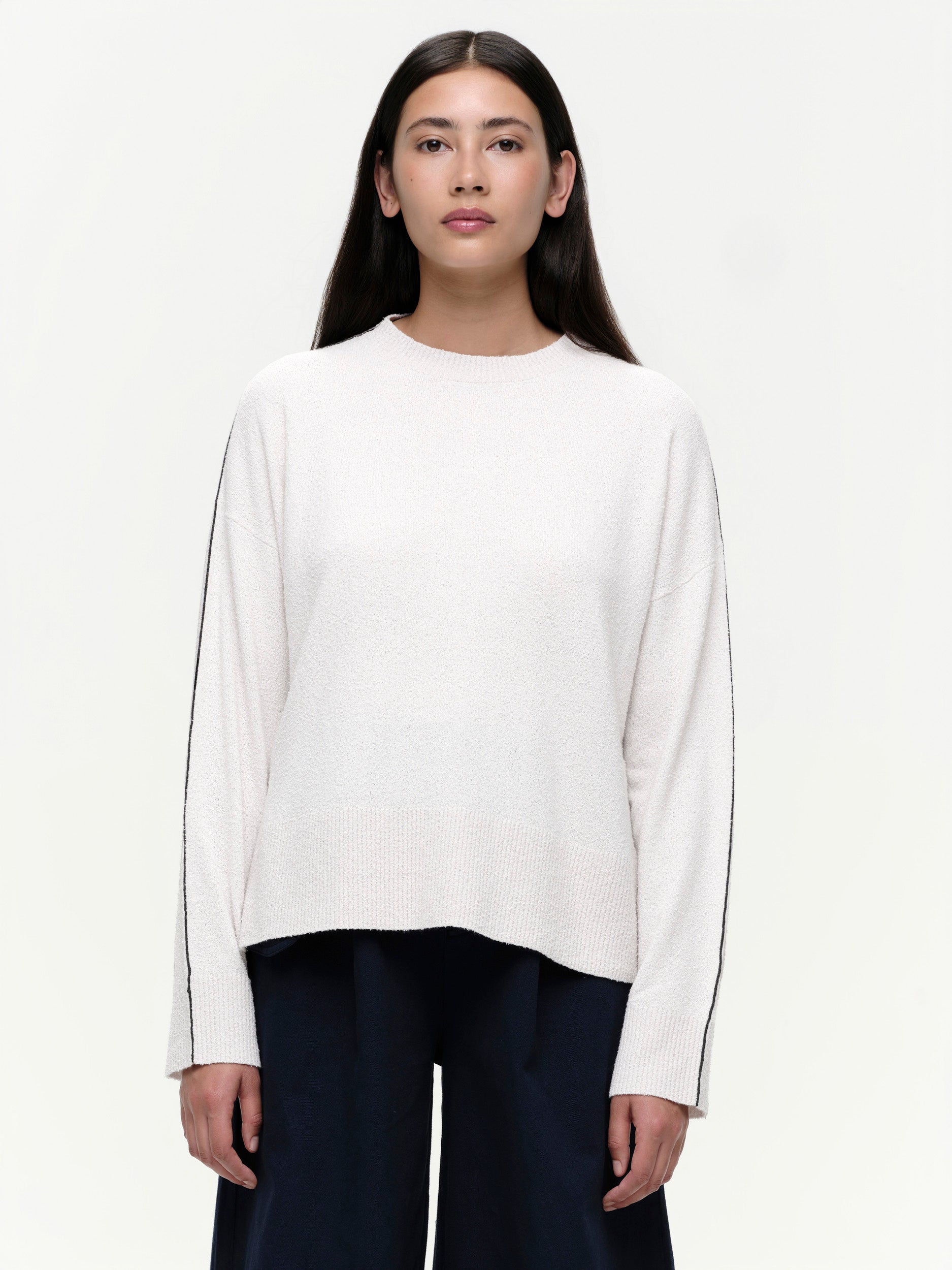 Lightweight bouclé knit summer sweater with a relaxed fit, featuring contrast stripe detailing at the back and sleeves and wide ribbed cuffs.