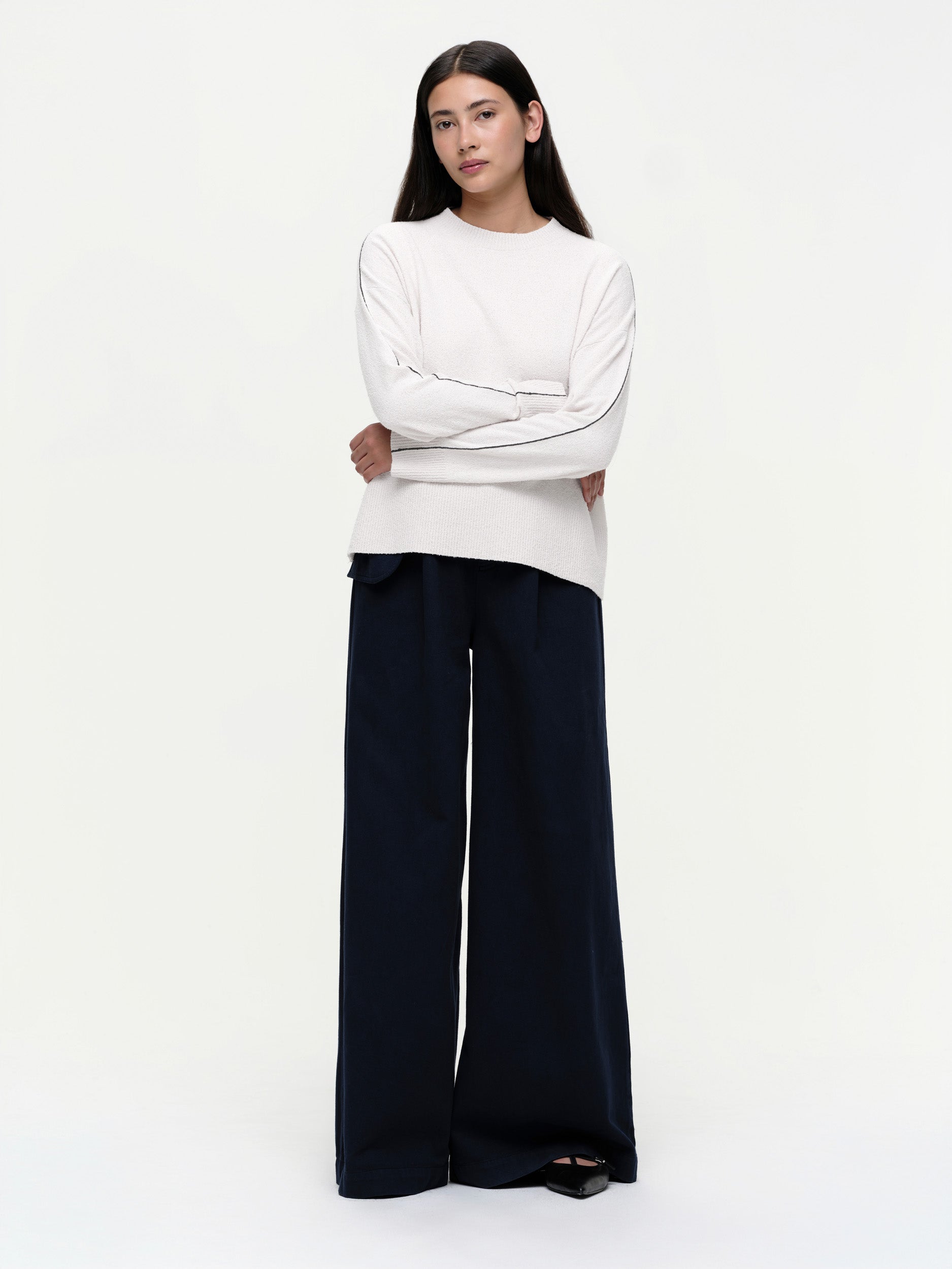 Lightweight bouclé knit summer sweater with a relaxed fit, featuring contrast stripe detailing at the back and sleeves and wide ribbed cuffs.