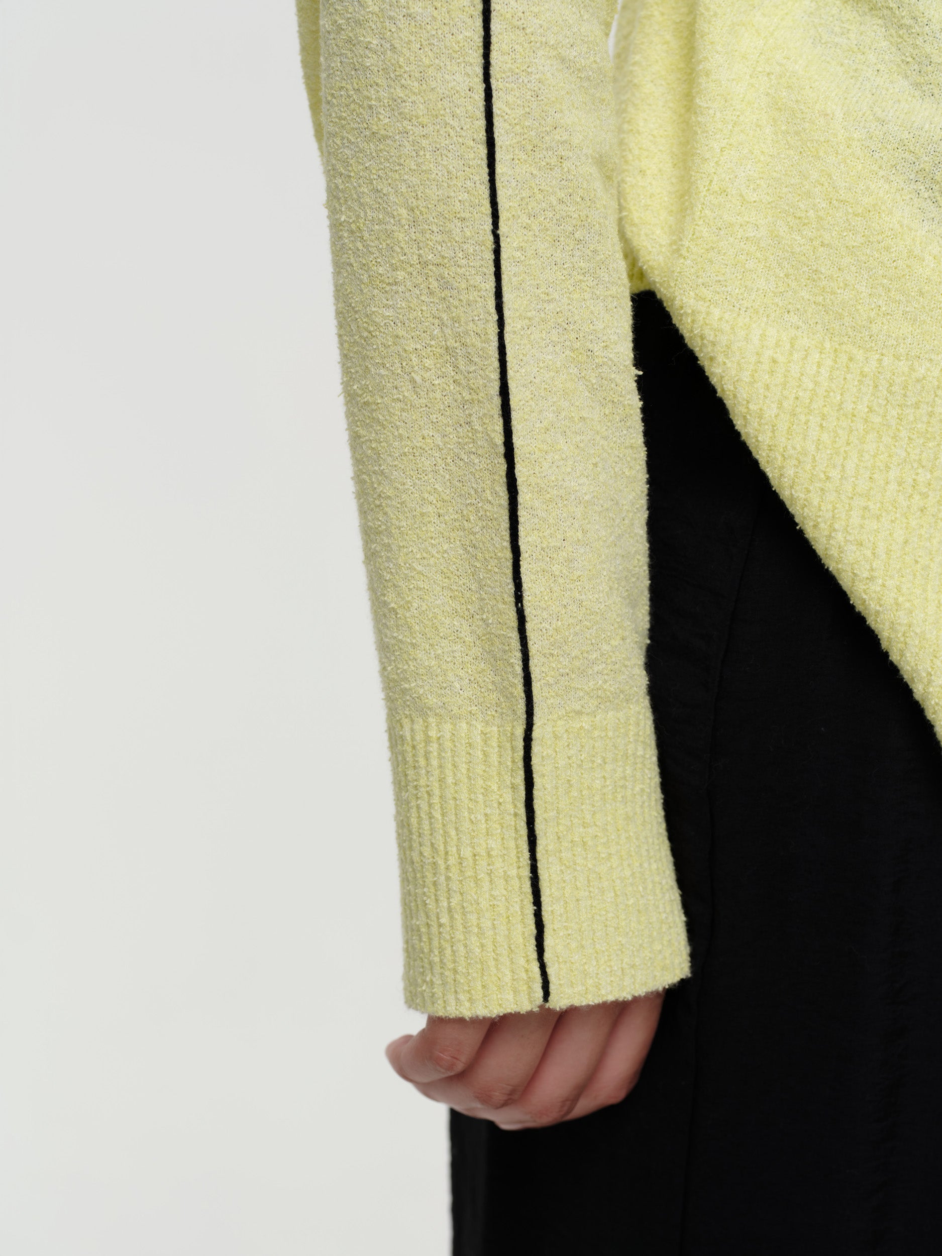 Lightweight bouclé knit summer sweater with a relaxed fit, featuring contrast stripe detailing at the back and sleeves and wide ribbed cuffs.