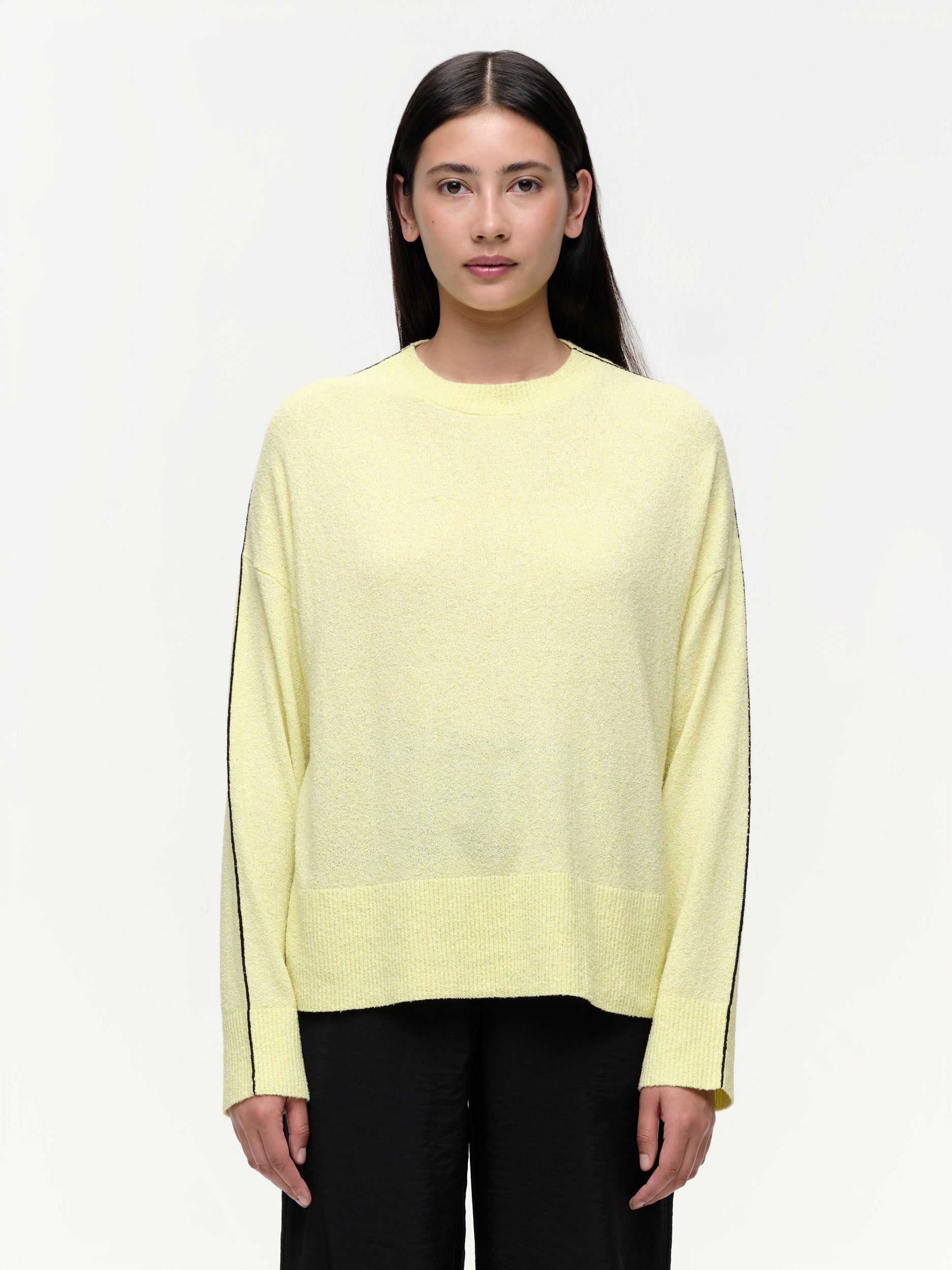 Lightweight bouclé knit summer sweater with a relaxed fit, featuring contrast stripe detailing at the back and sleeves and wide ribbed cuffs.